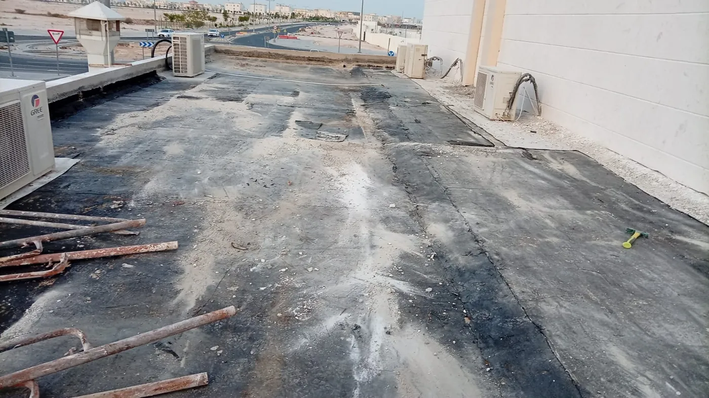 Existing roof: Condition survey of an ageing bitumen membrane.